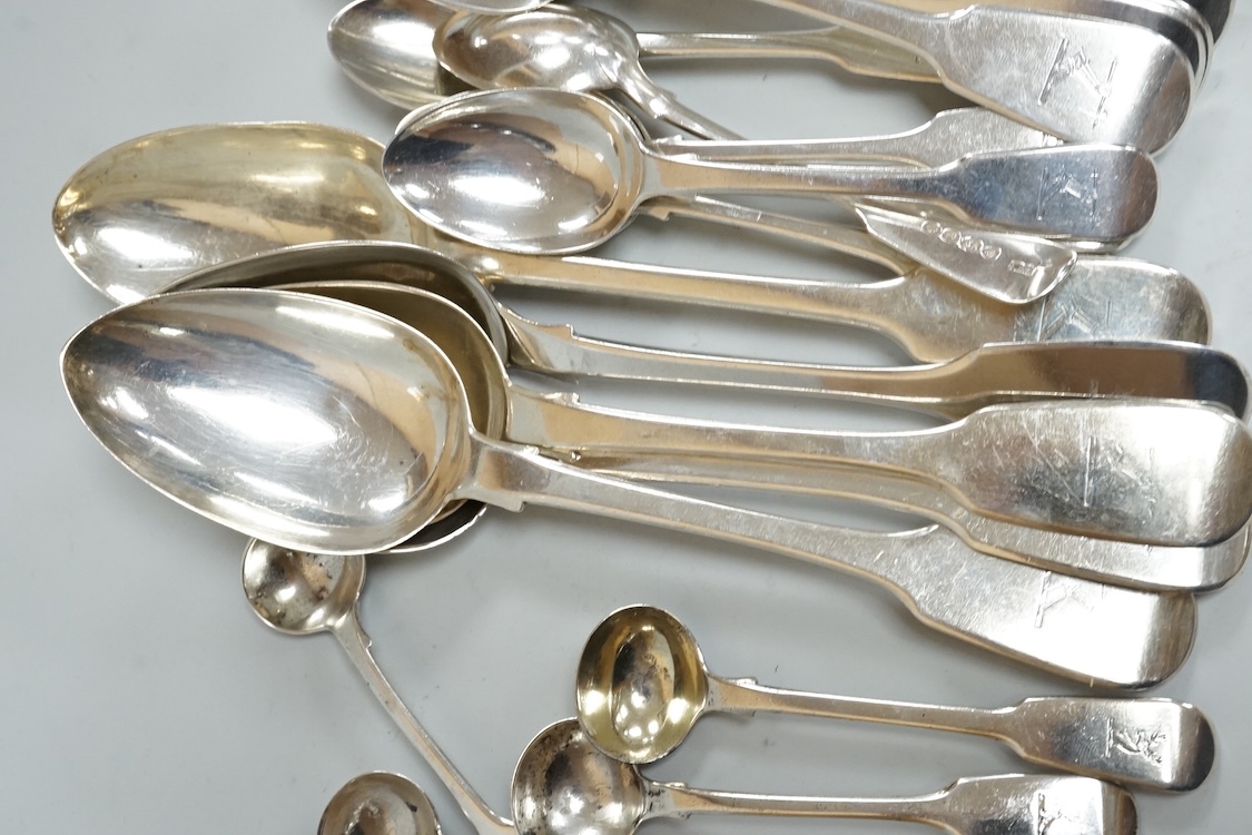 A harlequin part canteen of 19th century silver fiddle pattern flatware, comprising twenty six items, all with engraved crest various dates and makers, 32.3oz.